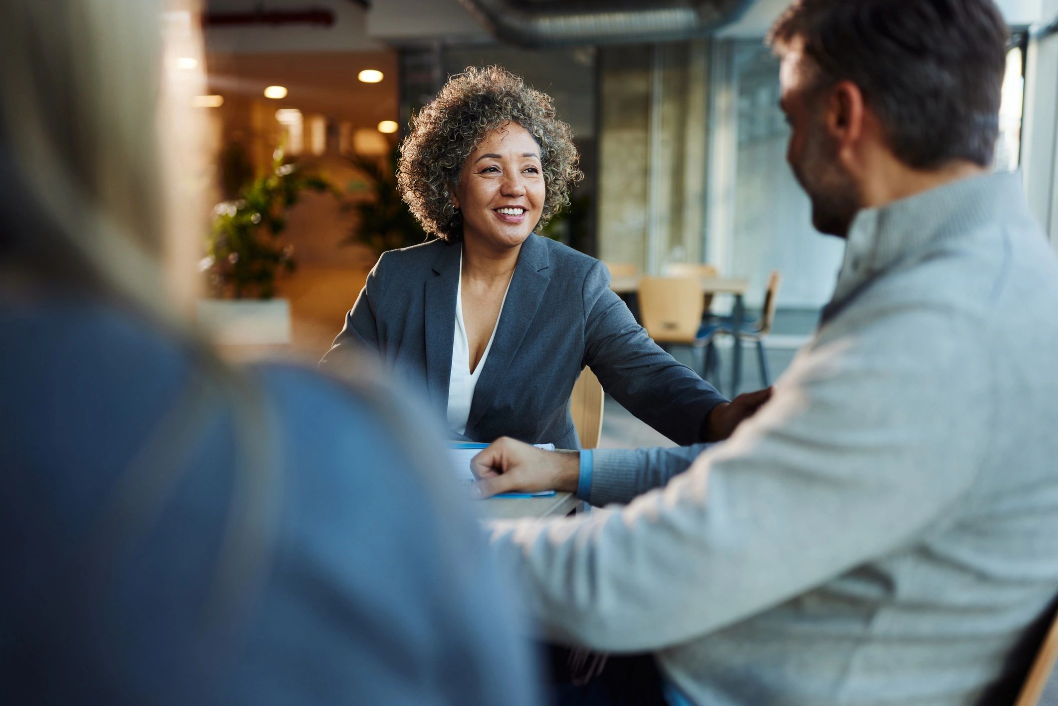 Consulting meeting with a business advisor and clients