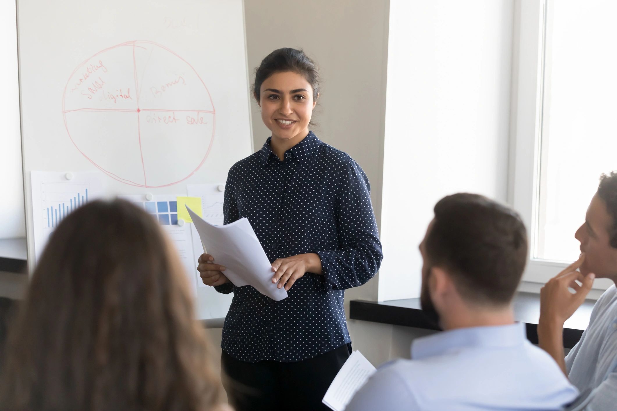 Consultant leading a training session with a team