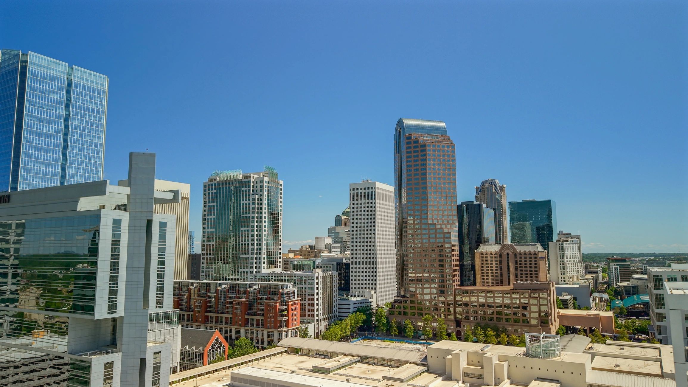 City skyline with multifamily and commercial buildings